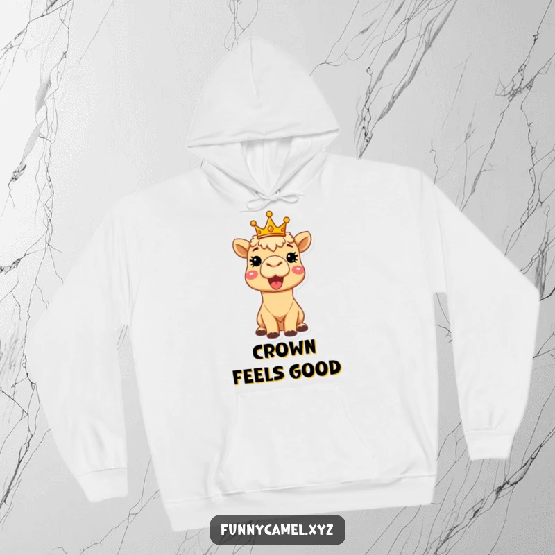 Funny delighted camel wearing a tiny crown, beaming brightly, featured on a soft, warm hoodie for cozy, royal comfort.